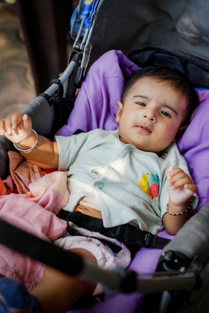baby boy lying down in stroller