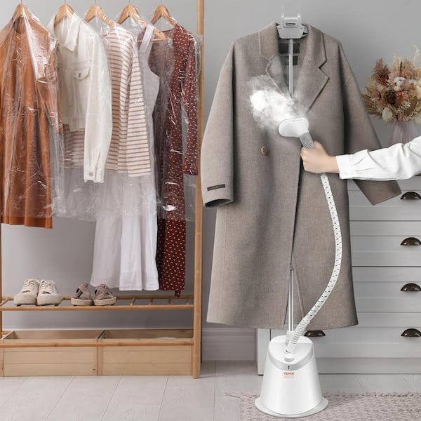 Handheld garment steamer removing wrinkles — best clothing steamers 2026