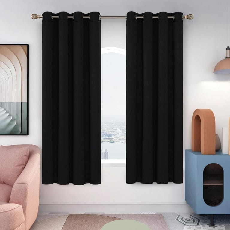 Blackout curtains hanging in a bedroom window - best blackout curtains 2026