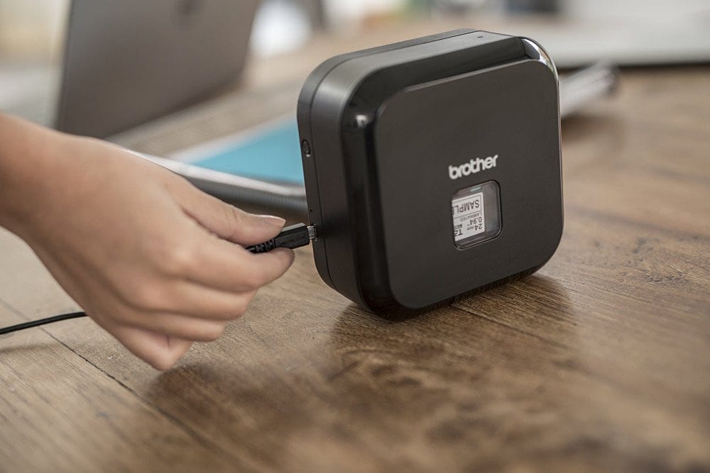 A Brother P-touch Cube Plus Bluetooth label maker on a white background