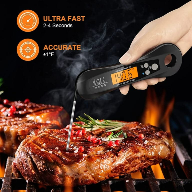 Instant-read meat thermometer measuring steak temperature