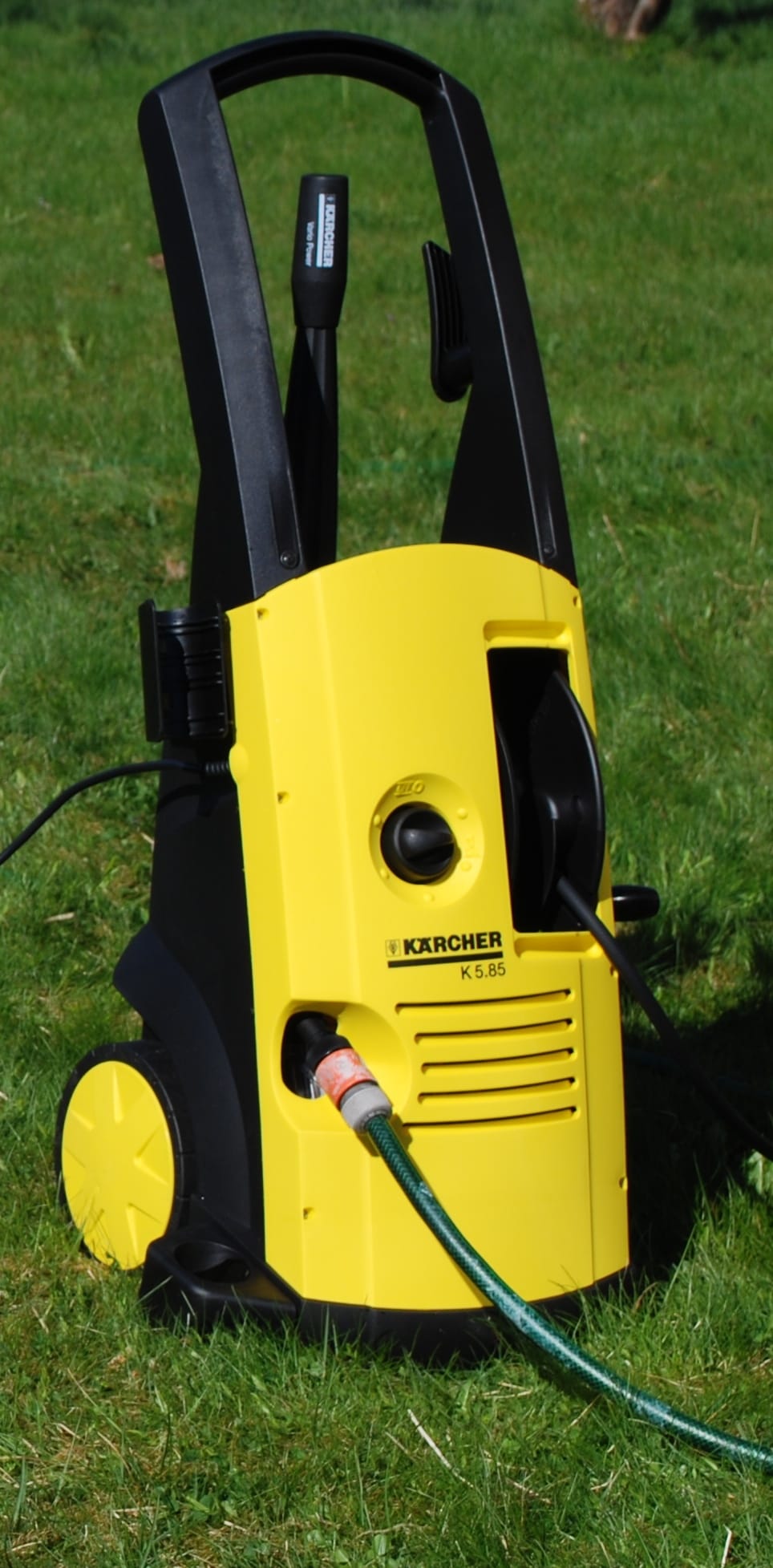Electric pressure washer on a patio surface