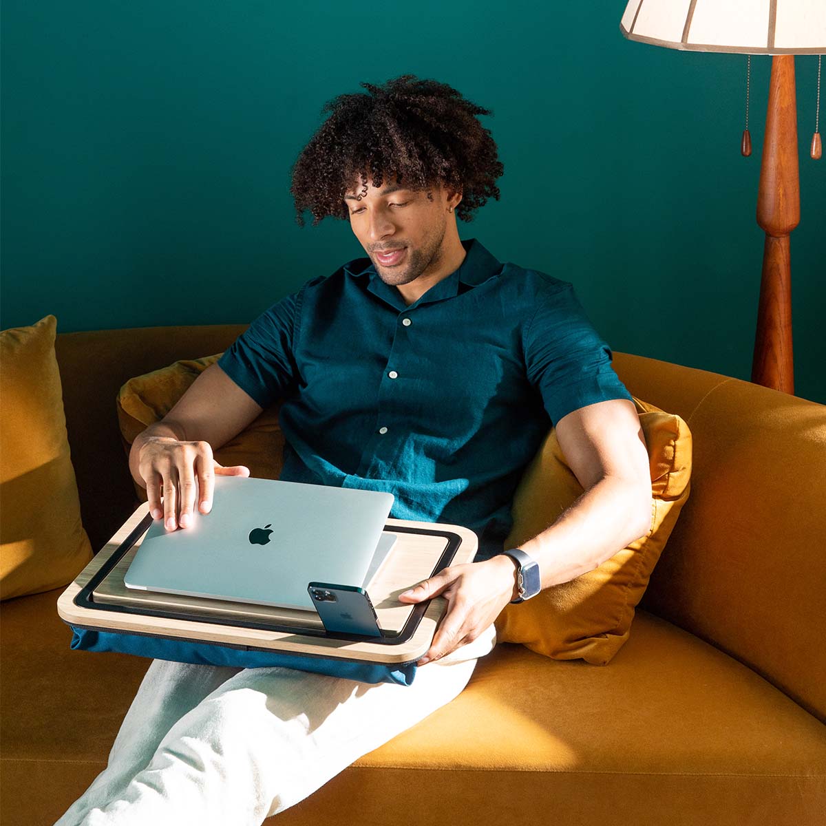 Laptop on a lap desk on a couch