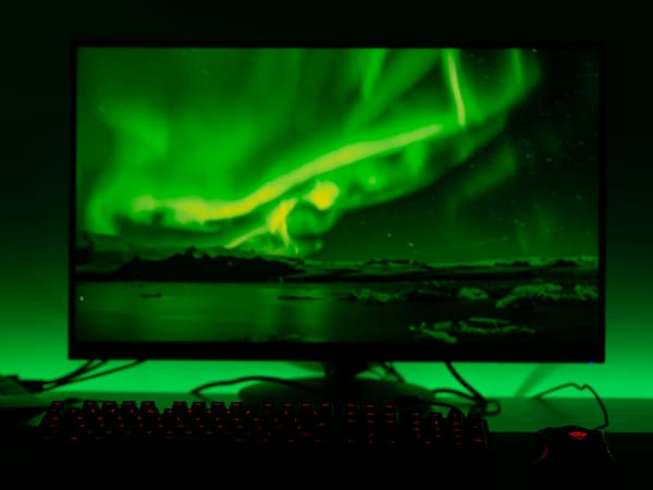 green and blue light on black computer keyboard