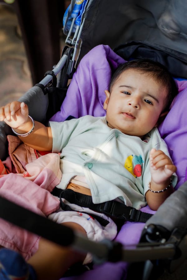 baby boy lying down in stroller