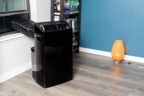 Portable air conditioner setup in a living room — best portable air conditioner 2026