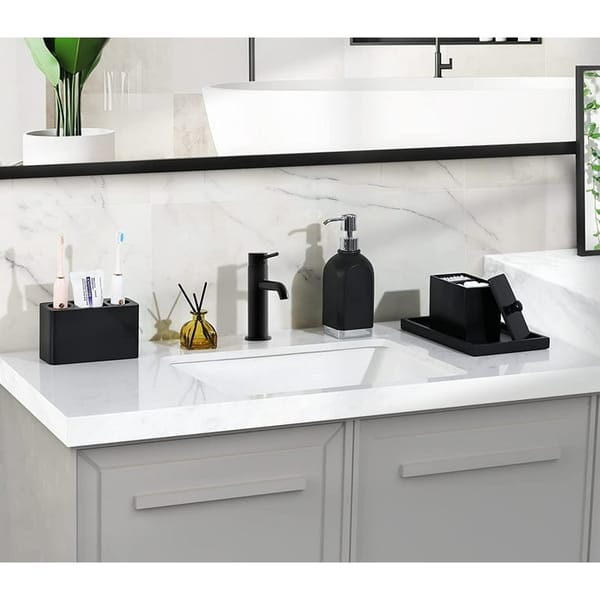 Electric toothbrush holder with toothbrushes on a bathroom counter