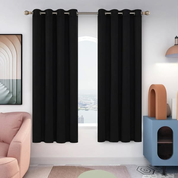 Blackout curtains hanging in a bedroom window - best blackout curtains 2026