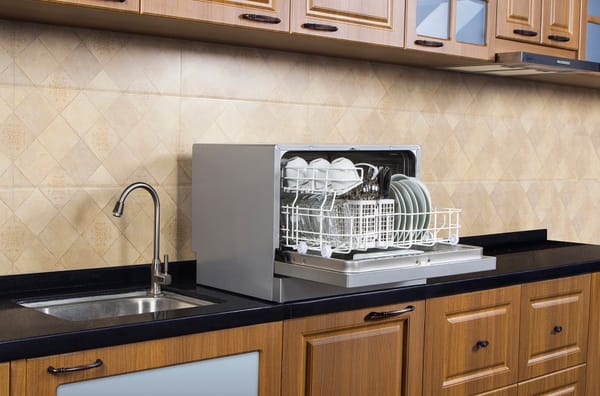 Portable countertop dishwasher in a kitchen - best portable dishwasher 2026